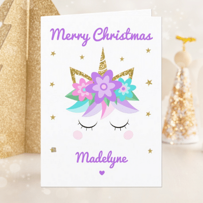 Personalized unicorn greeting card with cute unicorn face, purple flowers and glitter.