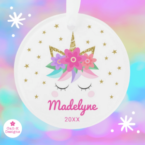 Unicorn Christmas ornament with cute unicorn face, pink flowers, gold glitter and stars.