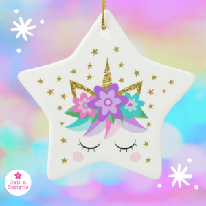 Unicorn Christmas ornament in a star shape with unicorn face, purple flowers, gold glitter and stars.