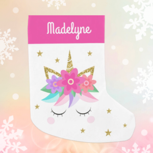 Personalized unicorn Christmas stocking with glitter and pink flowers.