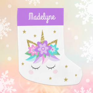 Personalized unicorn Christmas stocking with glitter and purple flowers.