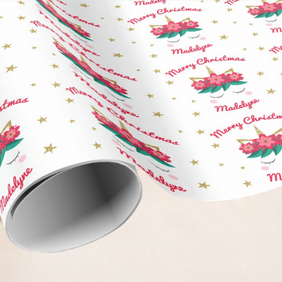 Personalized unicorn christmas wrapping paper with cute unicorn face, red flowers, berries and stars.