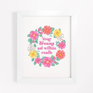 Motivational wall art with pink, orange and yellow floral wreath on white background with text: Your dreams are within reach.