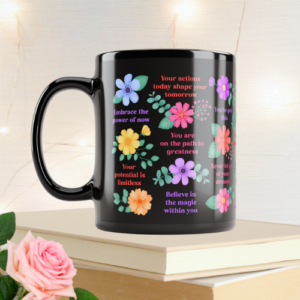 Black motivational mug with inspirational quotes and vibrant flowers and foliage.