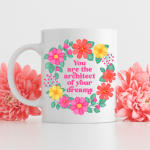 Motivational mug with vibrant floral wreath design and quote reads: you are the architect of your dreams.