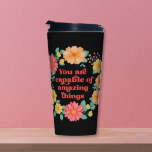 Motivational travel mug with yellow and orange floral wreath on black background with text: You are capable of amazing things.