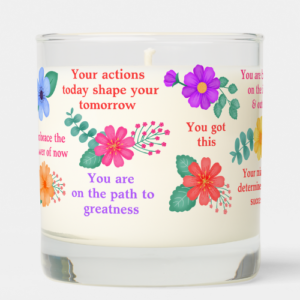 Inspirational candle with daily motivational reminder quotes with vibrant flowers.