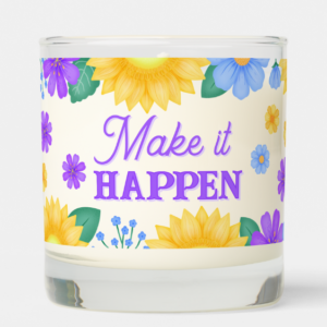 Inspirational candle with motivational quote: Make it happen in script typography and sunflowers with purple, and blue flowers.