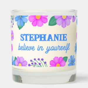 Personalized name gift candle with inspirational quote: Believe in yourself and blue, purple and pink flowers and foliage and script typography.