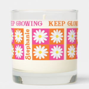 Dopamine decor candle with pink and orange daisy checkerboard design, personalized name and inspirational quote.
