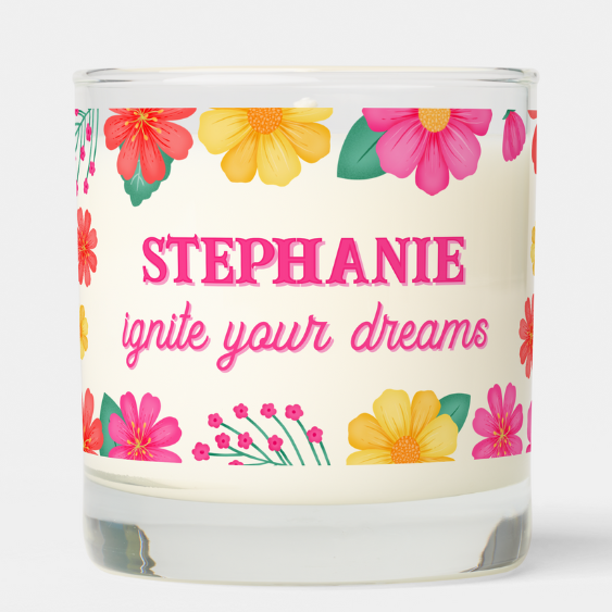 Personalized name gift candle with inspirational quote: Ignite your dreams and pink, yellow and orange flowers and foliage and script typography.