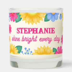 Personalized name gift candle with inspirational quote: Shine bright every day and sunflowers with pink and blue flowers and foliage and script typography.