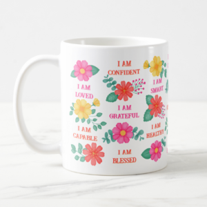 Positive affirmation gift mug with customizable I am affirmations and pink, orange and yellow floral design.