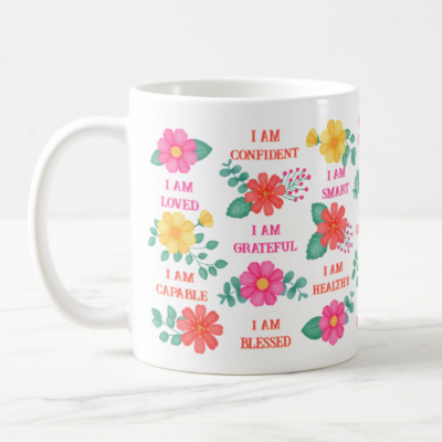 Positive affirmation gift mug with customizable I am affirmations and pink, orange and yellow floral design.